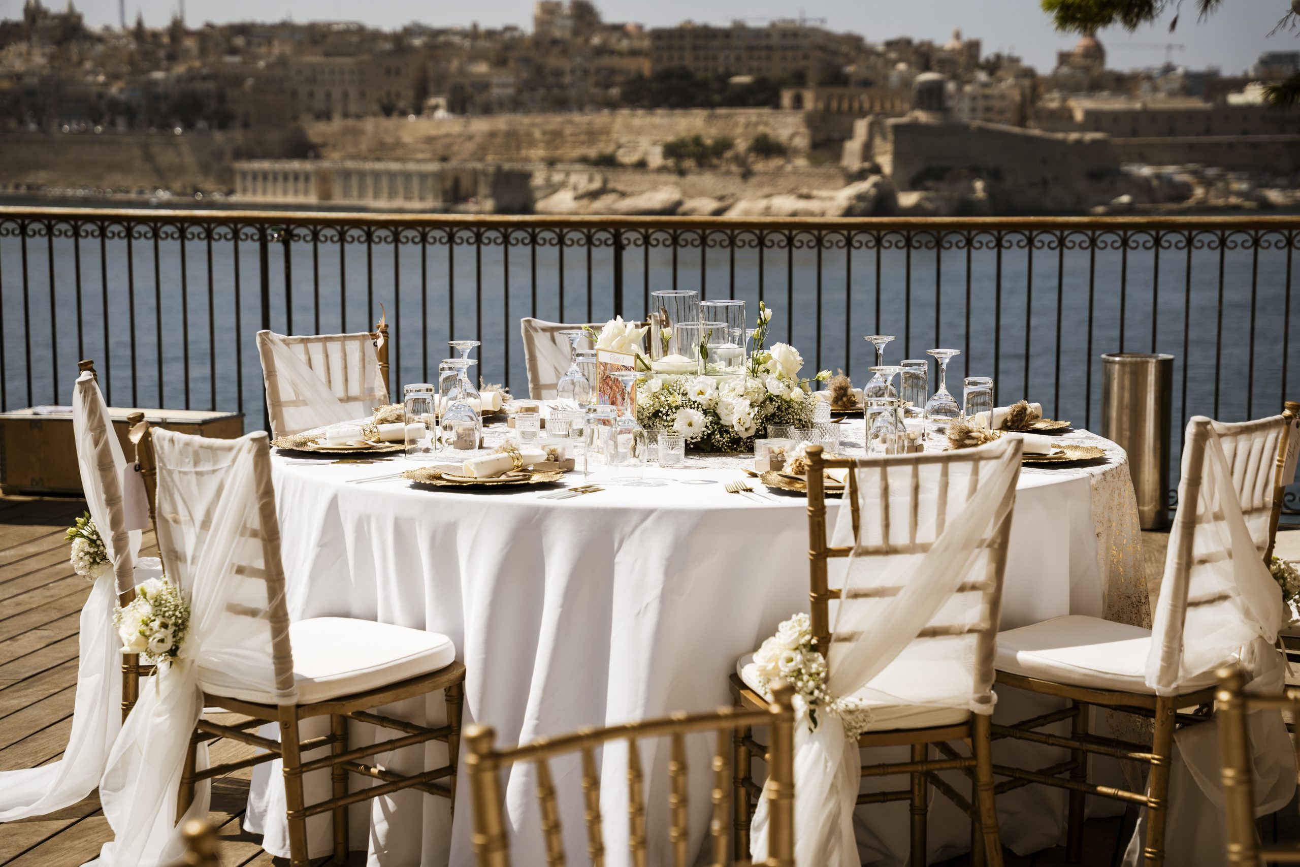 Outdoor Wedding Venue Setup in Malta Outdoor wedding reception table overlooking Valletta harbour in Malta